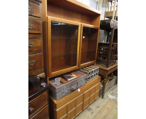 20th Century teak McIntosh display cabinet, having a shelf above a pair of glazed doors enclosing glass shelves above an alco