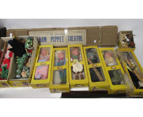 Nine various Pelham puppets in original boxes, together with a Pelham puppet theatre
