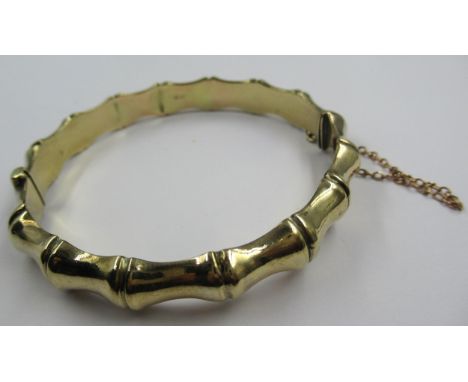9ct Gold bamboo design bangle, 14.6g6cm internal diameter.Three dents visible to inside and one dent to outside.