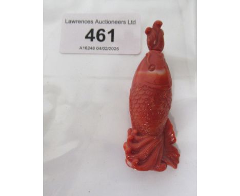 Chinese red carved jade snuff bottle, in the form of a fish, with stopper, 60mm long including stopperHairline fracture to on