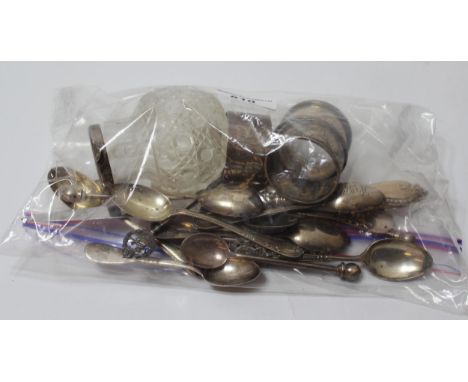 Three silver napkin rings, together with a quantity of silver spoons, silver ladle knives and forks, silver handled paper kni