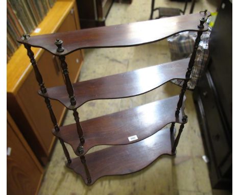 Walnut four shelf hanging wall bracket with turned supports, 66cm wide x 75cm high