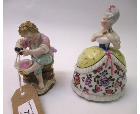 Meissen figure of a seated boy, holding grapes, (two small chips to base) 4.25ins high, together with a Goebel perfume flask 