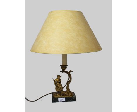 Reproduction gilt brass figural table lamp on a rectangular marble plinth, 48cm high including shade