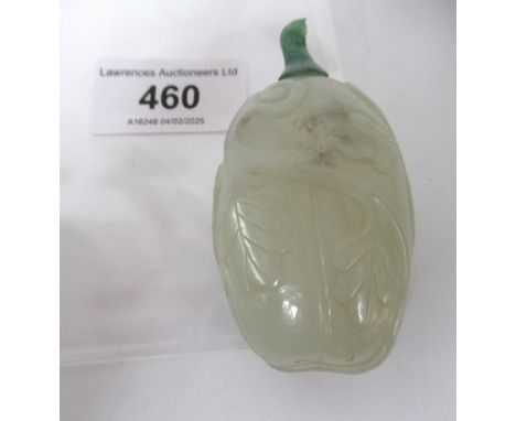 Chinese pale green jade snuff bottle, with floral relief carved decoration and a dark green jade stopper, 70mm high, includin
