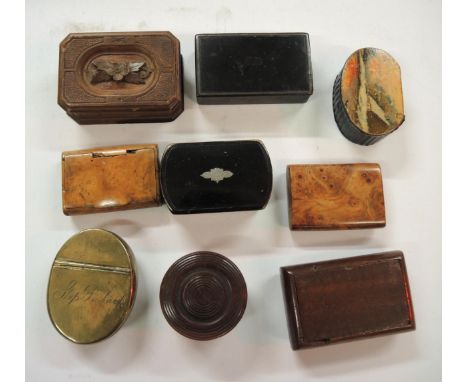 Small collection of wooden and papier mache snuff boxes including a brass snuff box