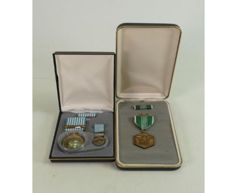 Two boxed US Army military medals: Comprising Commendation For Military Merit and United Nations Defence Korea large and mini