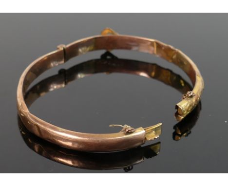 gold coloured metal bangle tested as 9ct or better: Item badly damaged, and weighing  6.5 g. 