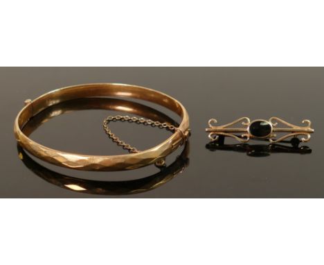 9ct gold brooch and gold cased metal core bangle: Brooch weighs 2.5g. 