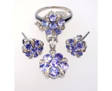 9 CT WHITE GOLD DIAMOND AND TANZANITE RING, SIZE K 1/2, SIMILAR EARRINGS AND NECKLACE ENSUITE, SHEFFIELD 2006, GROSS 8.0 GRAM