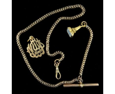 ARABIC YELLOW METAL CALLIGRAPHY PENDANT,(H. INC. BALE 2.8 CM), 3.7 GRAMS; A YELLOW METAL SEAL FOB ON A GILT METAL ALBERT CHAI