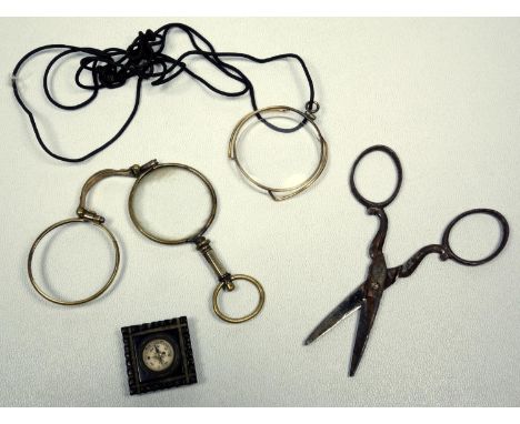 MINIATURE COMPASS SET IN JET, TOGETHER WITH A GOLD PLATED MONOCLE, LORGNETTE AND SCISSORS (4) 