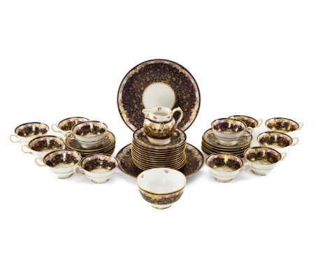 W.T. COPELAND BONE CHINA TEA SERVICE FOR TWELVE, pattern R5406, lavishly gilt and painted with a band of roses on a mazarine 
