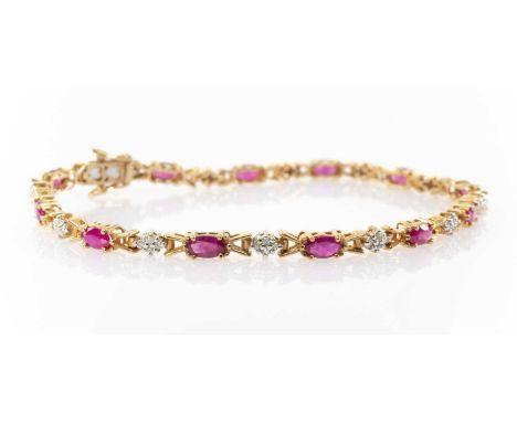YELLOW METAL DIAMOND CHIP & RUBY BRACELET, integrated box link pierced heart clasp, 19.5cms long, 7.9gmsProvenance: private c