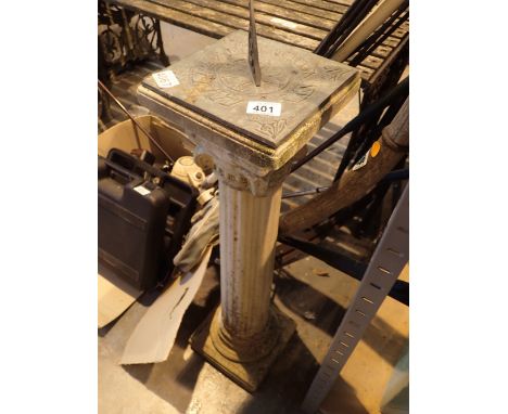 Brass sundial on reconstituted stones column base
