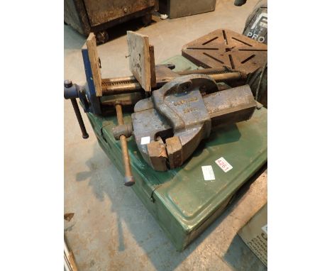 Two large bench vices and a military ammunition trunk