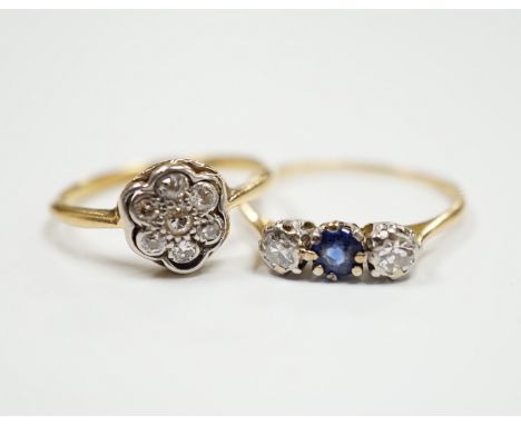 A 1920's 18ct, plat and diamond cluster set flower head ring, size M/N and a 18ct and plat. sapphire and diamond set three st