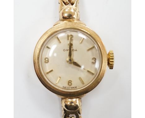 A lady's 9ct gold Omega manual wind wrist watch, on an associated 9ct gold bracelet, gross weight 17.6 grams, with Omega box.