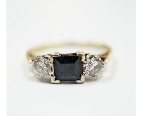 An 18ct gold, single stone sapphire and two stone diamond set ring, size O/P, gross weight 3.3 grams.