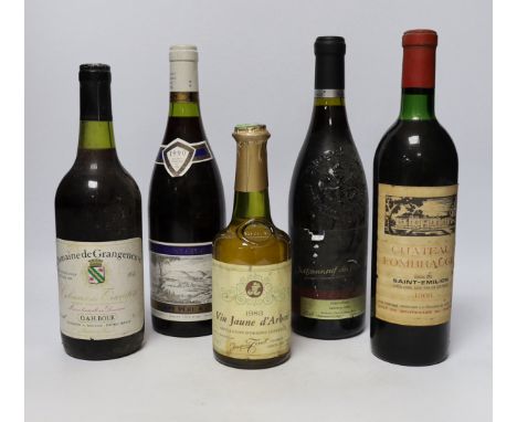 A bottle of Nuits Saint-Georges 1990 red wine, a bottle of Chateau Fombrauge, Saint-Emilion Grand Cru 1966, a bottle of Domai