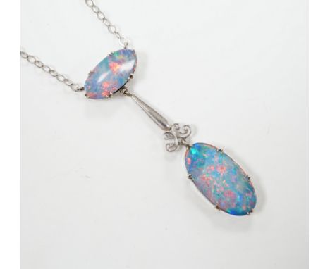 A 1920's style 9ct white metal and two stone black opal doublet set drop pendant necklace, overall 58cm, gross weight 4 grams