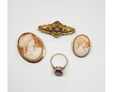 Two 9ct mounted oval cameo shell brooches, largest 38mm, a 9ct and gem set ring and a 9ct gold and gem set bar brooch.