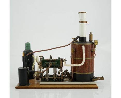 A Cheddar Models Ltd. Proteus steam plant, a gas fired vertical boiler two cylinder marine engine, with a wood clad copper bo