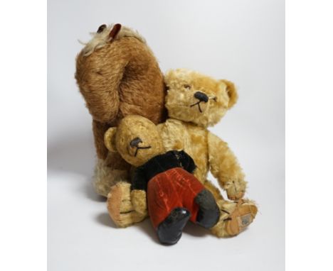 A Chad Valley teddy bear, 34cm high, a smaller bear in velvet clothes and a Merrythought horse