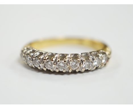 A modern 750 yellow metal and nine stone diamond chip set half hoop ring, size I/J, gross weight 3.1 grams.