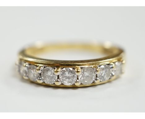 A modern 18ct gold and seven stone diamond set half hoop ring, size N, gross weight 4 grams.