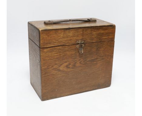 A vintage travelling vets box with two glass bottles and a stoneware bottle, Alfred Parker label to the interior, 24cm high