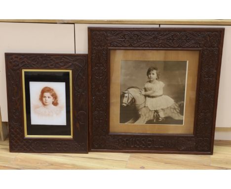 A large photographic print, Infant on rocking horse, housed in a carved frame ‘Russel, 1891’, and another similar framed sepi
