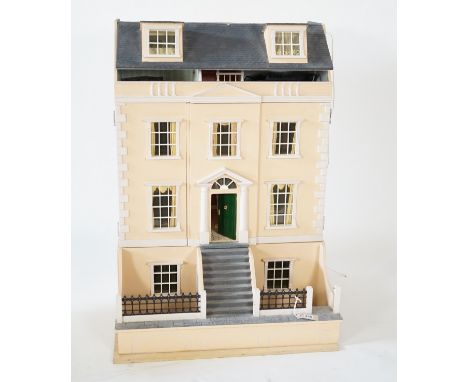 A large modern Georgian style dolls house and extensive contents, with eight fully decorated rooms on four floors, and fitted