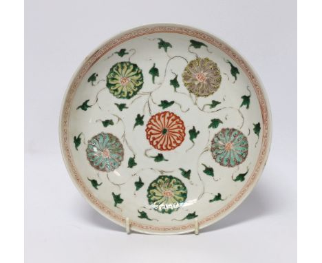 A Chinese famille verte ‘lotus flower’ dish, Kangxi period, 23cm diameter Three small chips to rim; some wear to enamels; oth