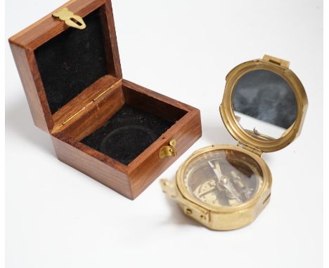A gilt metal circular pocket barometer by Gallagher and Co., New Bond Street, London (lacks case) and a reproduction solid br