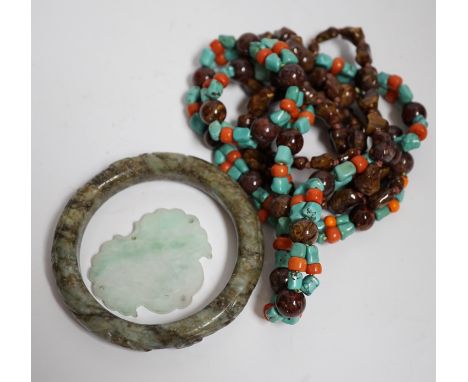 Two Chinese hardstone necklaces, a carved bangle and a jade carving, bangle 8.5cm in diameter