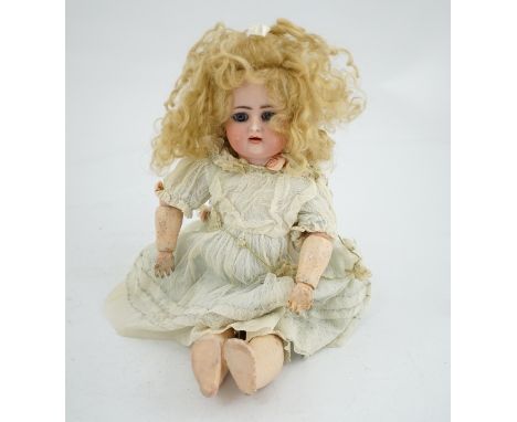 A Kammer &amp; Reinhart / S &amp; H bisque head doll, pierced ears, vintage clothes, one finger missing, slight rub to robe, 