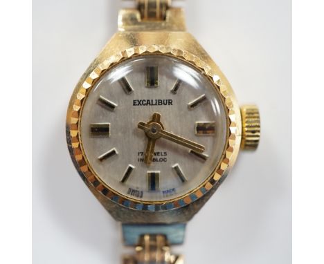 A lady's 9ct gold Excalibur manual wrist watch, on a 9ct gold bracelet, overall 17.5cm, gross weight 12 grams.