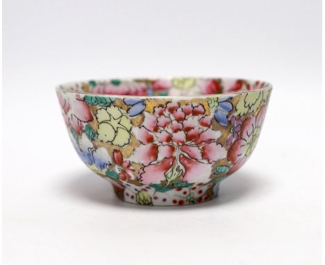 A small circular Chinese porcelain bowl having polychrome 'millefiore' and gilt decoration, diameter 11.5cm, red seal mark to