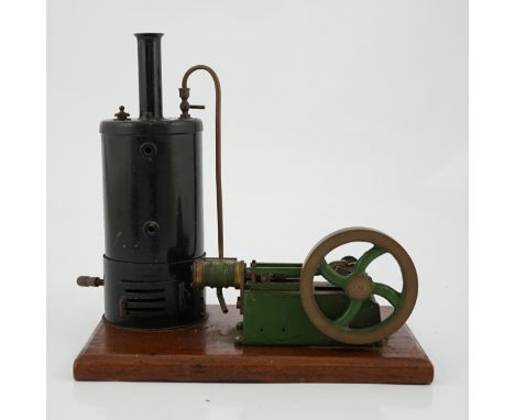 A Stuart Turner style stationary steam plant, with vertical boiler with fittings for a water sight glass and a pressure gauge