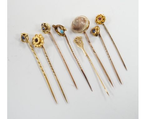 Eight assorted early 20th century and later yellow metal and gem set stick pins, including six 15ct, one 585 and one unmarked