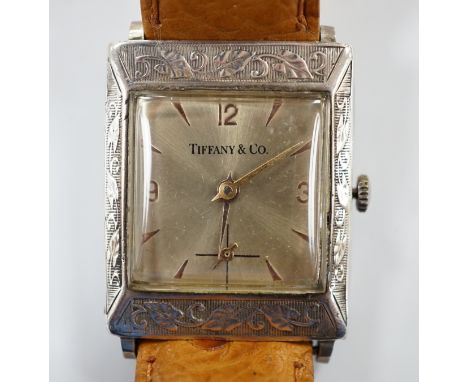 A German sterling manual wind dress wrist watch, retailed by Tiffany & Co, with baton and quarterly Arabic numerals, on an as