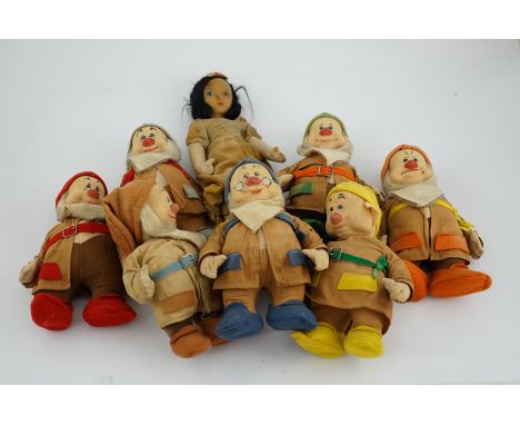 A set of Merrythought Snow White and the Seven Dwarves, Snow White with Merrythought label to the sole of her foot, the Dwarv