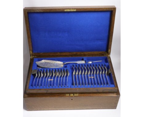 A Victorian oak cased matched canteen of silver fiddle and shell pattern flatware, by John &amp; Henry Lias &amp; H.J. Lias &