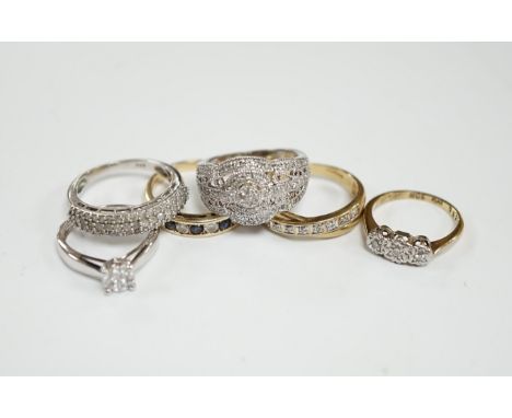 Five assorted modern 9ct and gem set rings including diamond chip cluster and sapphire and diamond chip, gross weight 12.7 gr