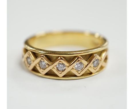 A modern 18ct gold and five stone diamond set half hoop ring, size O, gross weight 6.2 grams.