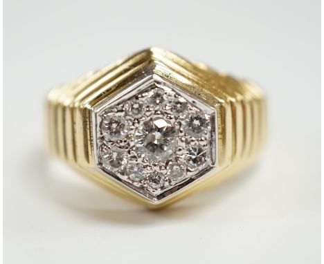 A modern 18ct gold and diamond set hexagonal cluster ring, size Q, gross weight 11.3 grams.