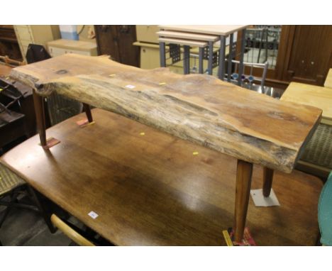 A RUSTIC WOODEN BENCH 
