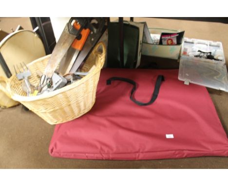 A BASKET OF TOOLS TOGETHER WITH A FOLDING PET CAGE 
