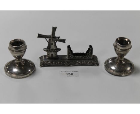 A PAIR OF HALLMARKED SILVER DWARF CANDLE STICK HOLDERS TOGETHER WITH A WHITE METAL WINDMILL 